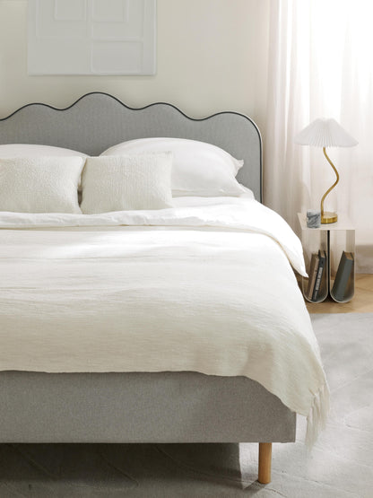 Romvaila Upholstered Bed with Wavy Headboard